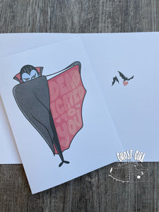 A vampire extending cape on one side, and reads "Dead-icated to you" 