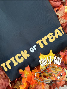 Tote Bag with Trick or Treating Ghosts Design- Backside reads "trick or treat"