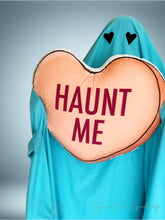 Load image into Gallery viewer, a 22 inch pillow, shaped like a candy heart that says &quot;Haunt Me&quot; 