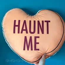 Load image into Gallery viewer, a 22 inch pillow, shaped like a candy heart that says &quot;Haunt Me&quot; 