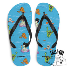 Load image into Gallery viewer, Unisex flip flops in a blue color representing waves, includes monsters having a swim party. Summerween style flip flop 