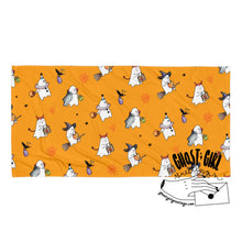 Load image into Gallery viewer, Beach towel in orange color featuring ghosts in costumes 