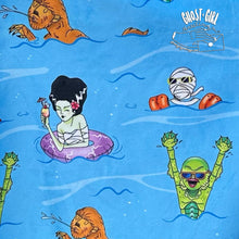 Load image into Gallery viewer, Blue beach towel with Monsters having a pool party! 